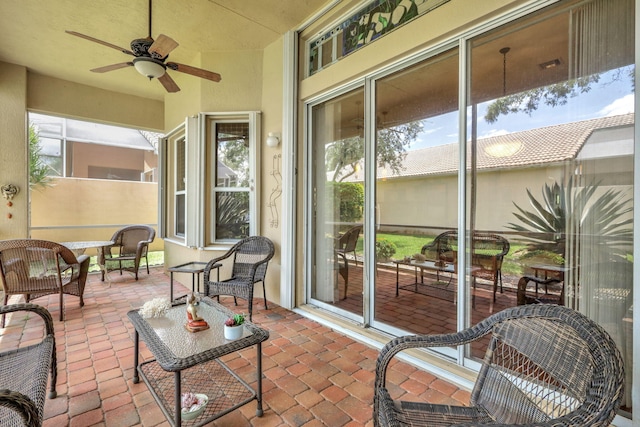 exterior space with plenty of natural light and ceiling fan