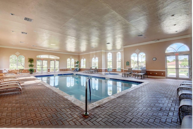 view of pool with french doors