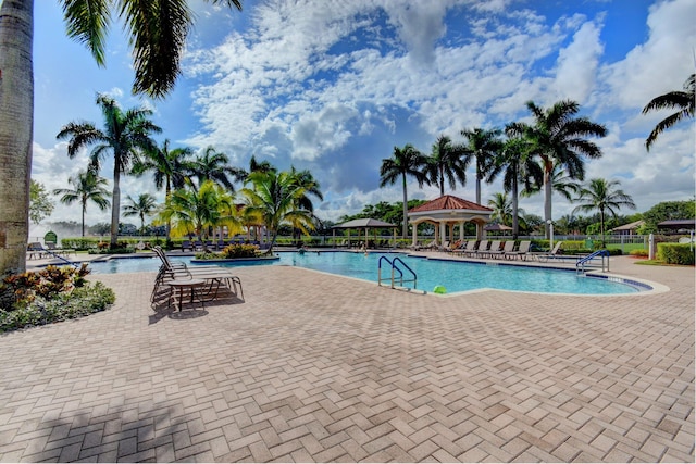 view of swimming pool featuring a patio and a gazebo