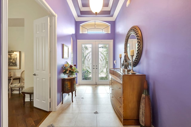 foyer entrance featuring light wood-type flooring and crown molding