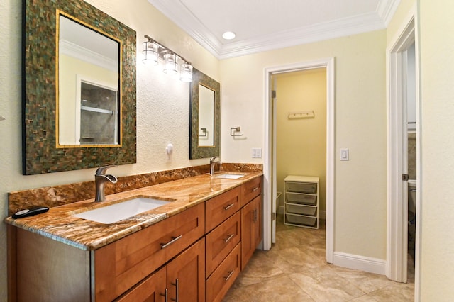 bathroom featuring vanity, crown molding, toilet, and tile patterned floors