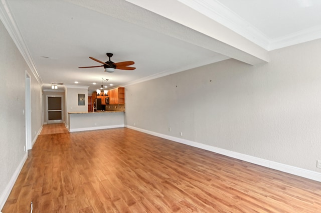 unfurnished living room with ornamental molding, ceiling fan with notable chandelier, and light wood-type flooring