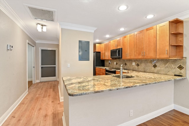 kitchen with tasteful backsplash, kitchen peninsula, light hardwood / wood-style floors, crown molding, and electric panel