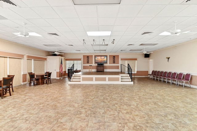 interior space with ceiling fan