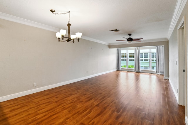 spare room with dark wood-type flooring, a textured ceiling, crown molding, and ceiling fan with notable chandelier