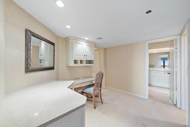 home office with light colored carpet