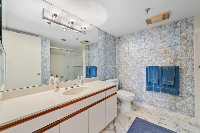 bathroom featuring tile patterned floors, vanity, and toilet