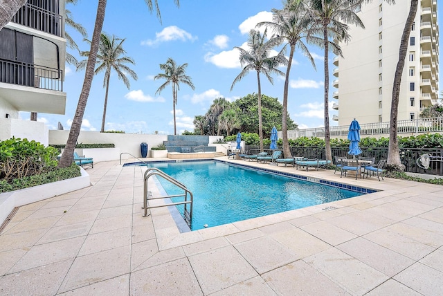 view of swimming pool featuring a patio area