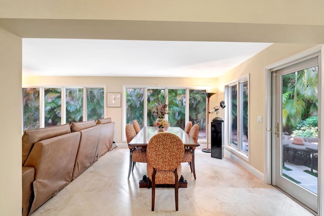 tiled dining area featuring a wealth of natural light