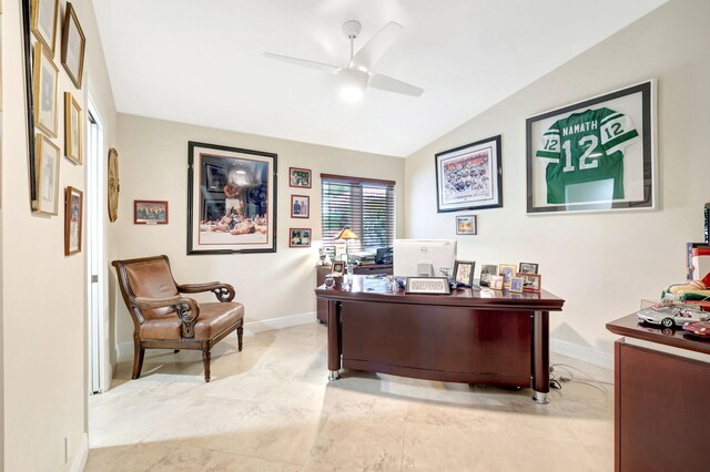 tiled office with lofted ceiling and ceiling fan