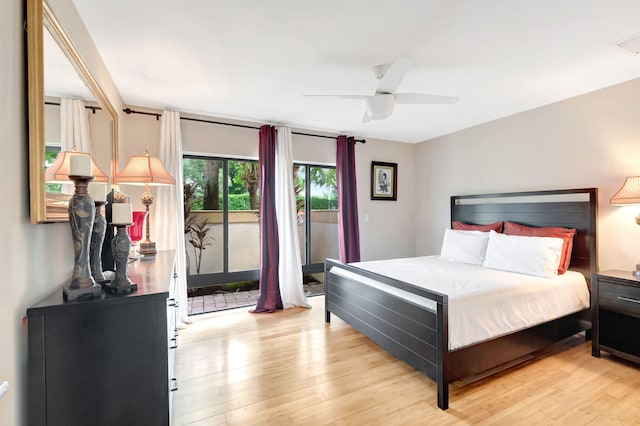 bedroom with light hardwood / wood-style flooring, ceiling fan, and access to outside