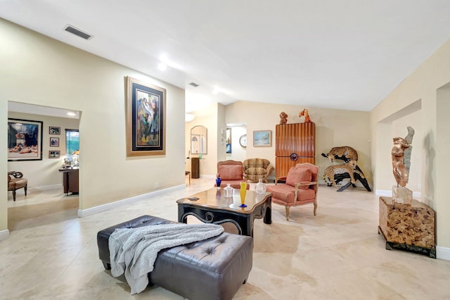 tiled living room featuring lofted ceiling