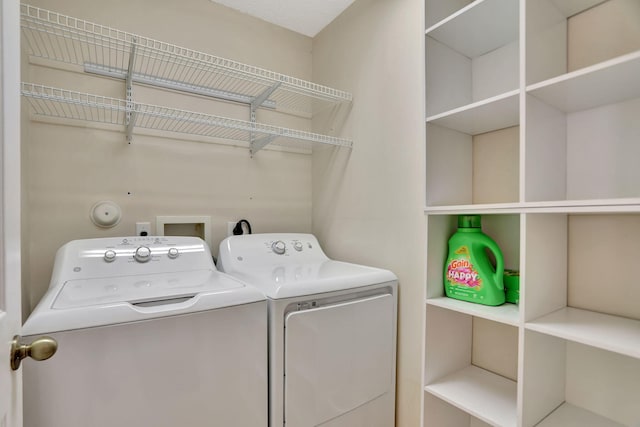 washroom featuring independent washer and dryer