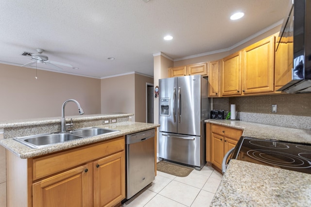 kitchen with sink, crown molding, ceiling fan, light tile patterned flooring, and stainless steel appliances