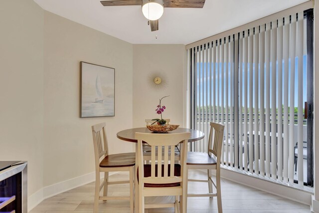 dining area featuring ceiling fan and light hardwood / wood-style flooring