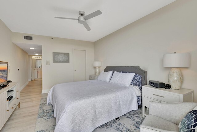 bedroom with ceiling fan and light wood-type flooring