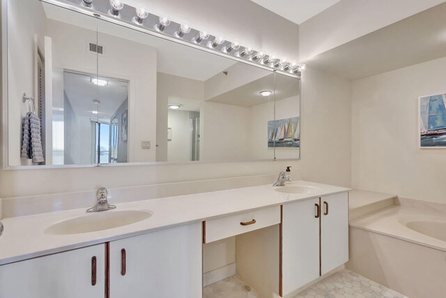 bathroom with separate shower and tub, tile patterned flooring, and vanity