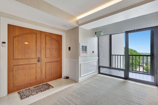 foyer entrance with light tile patterned floors