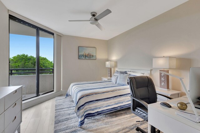 bedroom featuring ceiling fan, light hardwood / wood-style flooring, and access to exterior