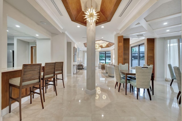 dining space featuring ornamental molding and a chandelier