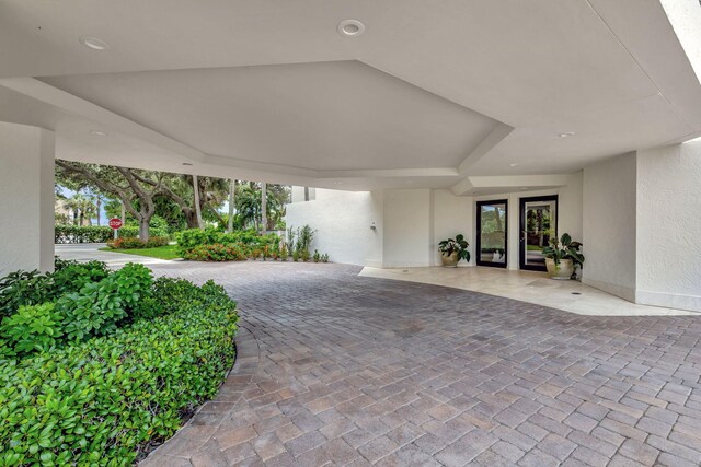 view of exterior entry featuring french doors