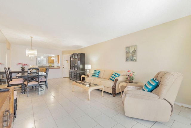 living room featuring a chandelier and light tile patterned floors