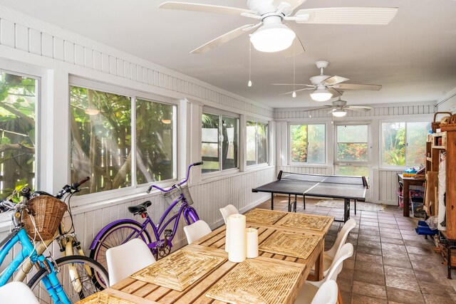 dining area featuring ceiling fan and tile patterned floors