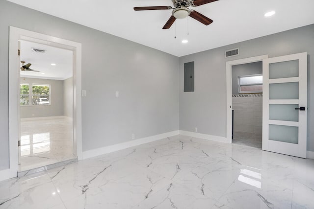 unfurnished bedroom featuring ceiling fan, electric panel, and light tile patterned floors