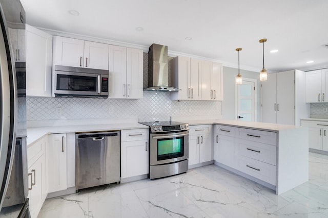 kitchen with light tile patterned flooring, decorative light fixtures, appliances with stainless steel finishes, decorative backsplash, and wall chimney range hood