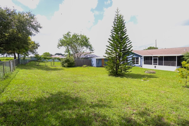 view of yard with a sunroom