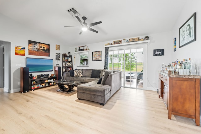 living room with ceiling fan and light hardwood / wood-style floors