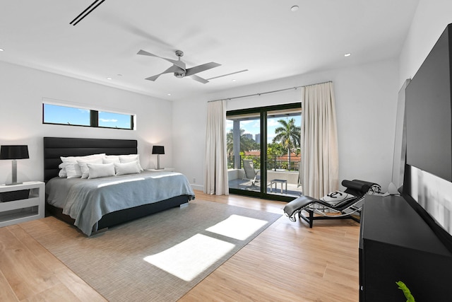 bedroom with access to outside, light hardwood / wood-style floors, and ceiling fan