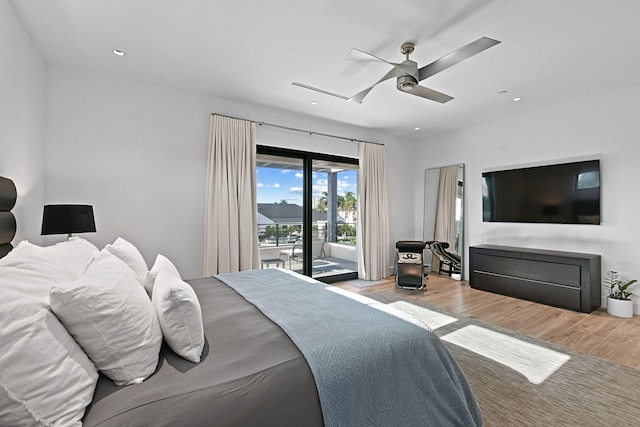 bedroom featuring access to outside, light hardwood / wood-style flooring, and ceiling fan