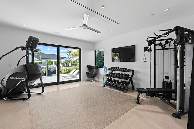 exercise room with ceiling fan