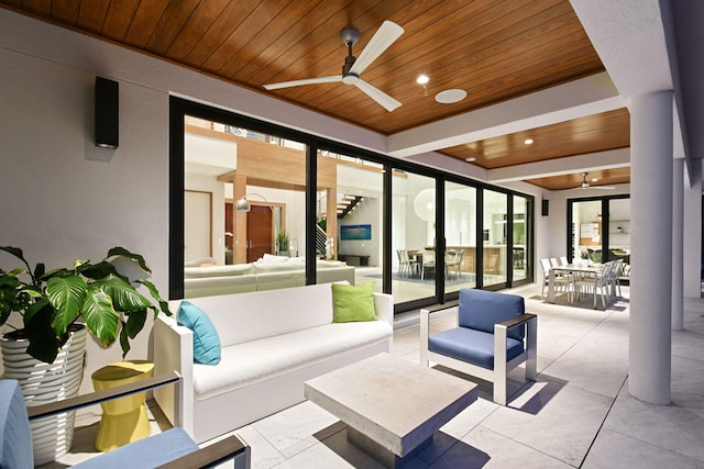 view of patio / terrace featuring ceiling fan and an outdoor living space