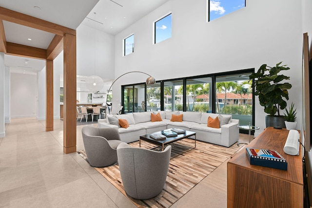 living room with a high ceiling