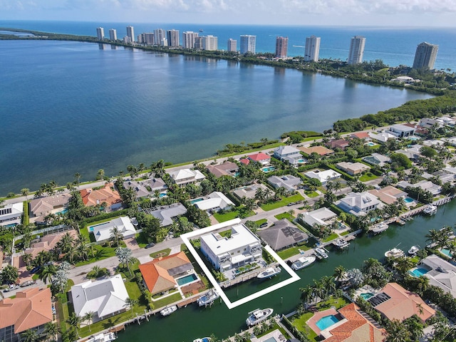 birds eye view of property featuring a water view