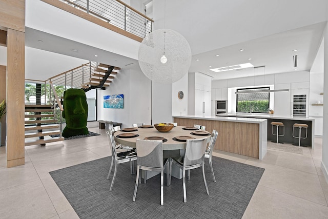 dining area featuring light tile patterned flooring and plenty of natural light