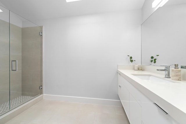 bathroom featuring tile patterned floors, walk in shower, and vanity