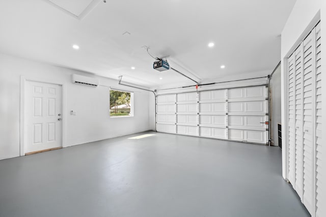 garage featuring a wall mounted air conditioner and a garage door opener