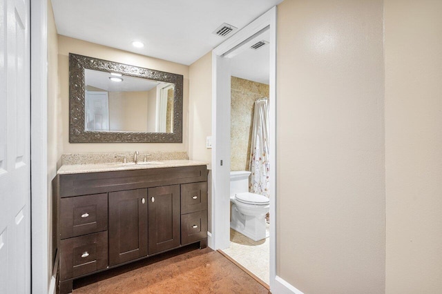 bathroom with toilet, vanity, visible vents, and a shower with curtain