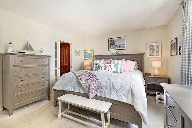 bedroom featuring light colored carpet