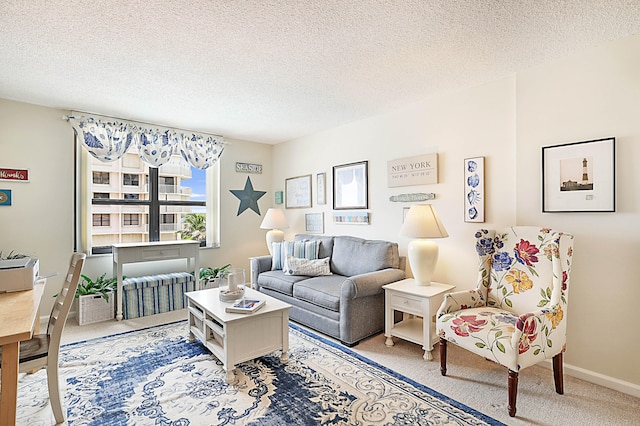 living room featuring a textured ceiling and light colored carpet