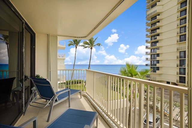 balcony featuring a water view