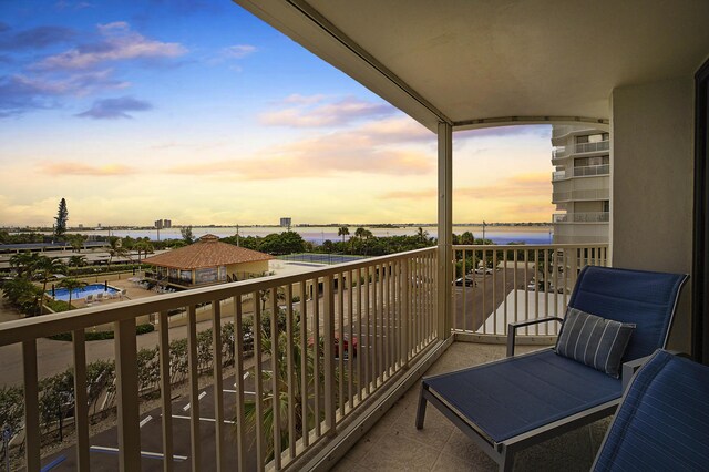 balcony at dusk with a water view