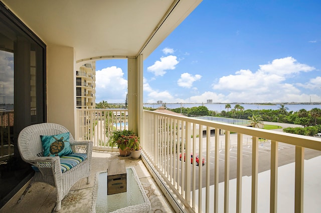 balcony featuring a water view