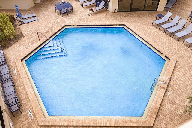 view of swimming pool featuring a patio