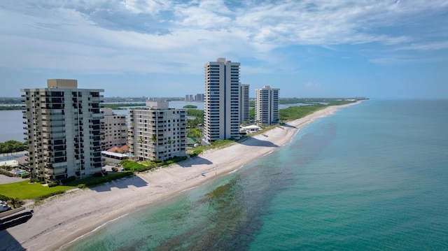 drone / aerial view with a view of the beach, a water view, and a view of city