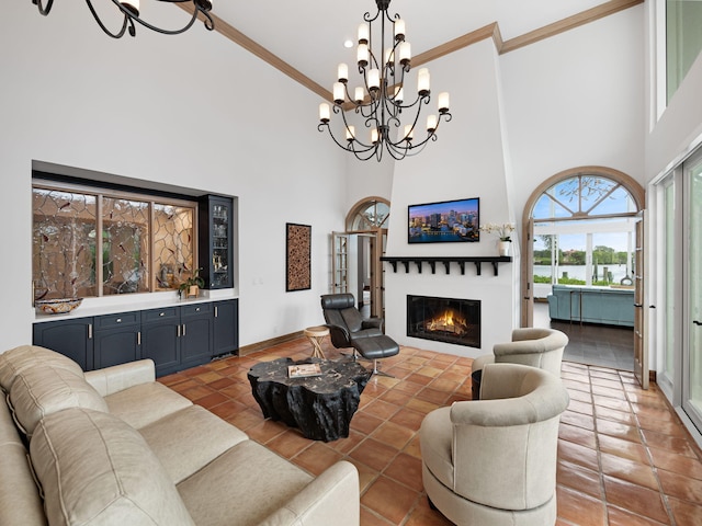 tiled living room featuring a high ceiling and an inviting chandelier