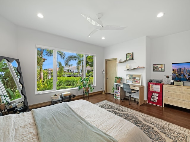 bedroom with ceiling fan and dark hardwood / wood-style floors